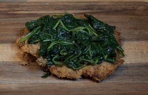 Spinach over schnitzel